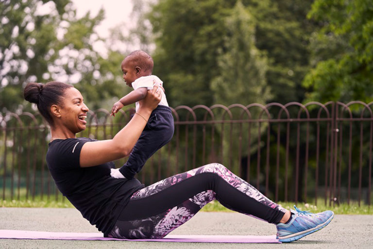 a mum working out with a baby