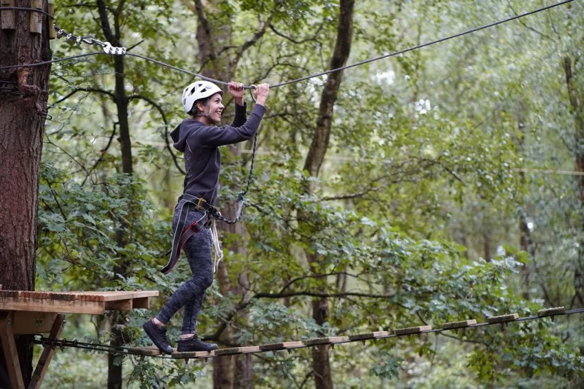 person on high ropes activity