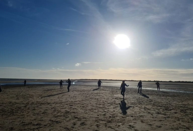 people dancing on beach