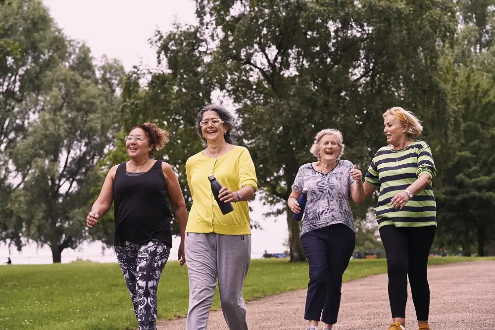 Group of women walking and laughing