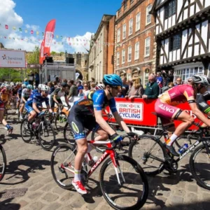 Cyclist racing through streets of uphill Lincoln.