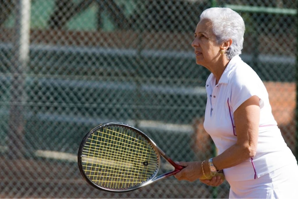 A senior lady playing walking tennis in Lincolnshire.