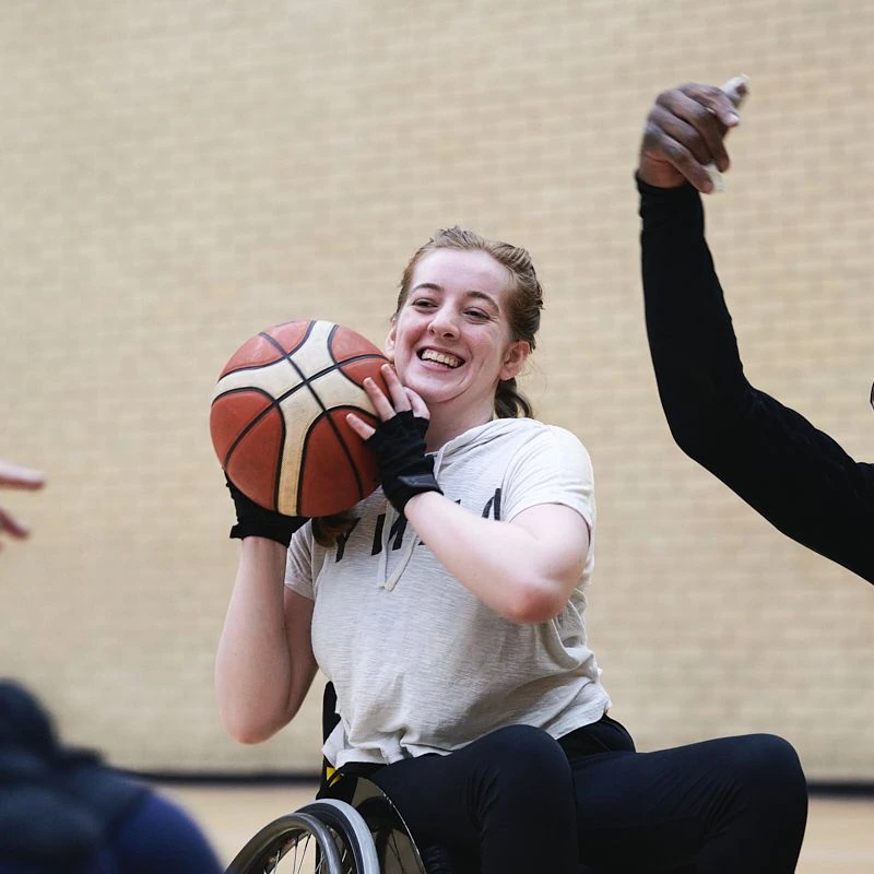 How active should I be? Young woman playing wheelchair basketball in Lincolnshire.