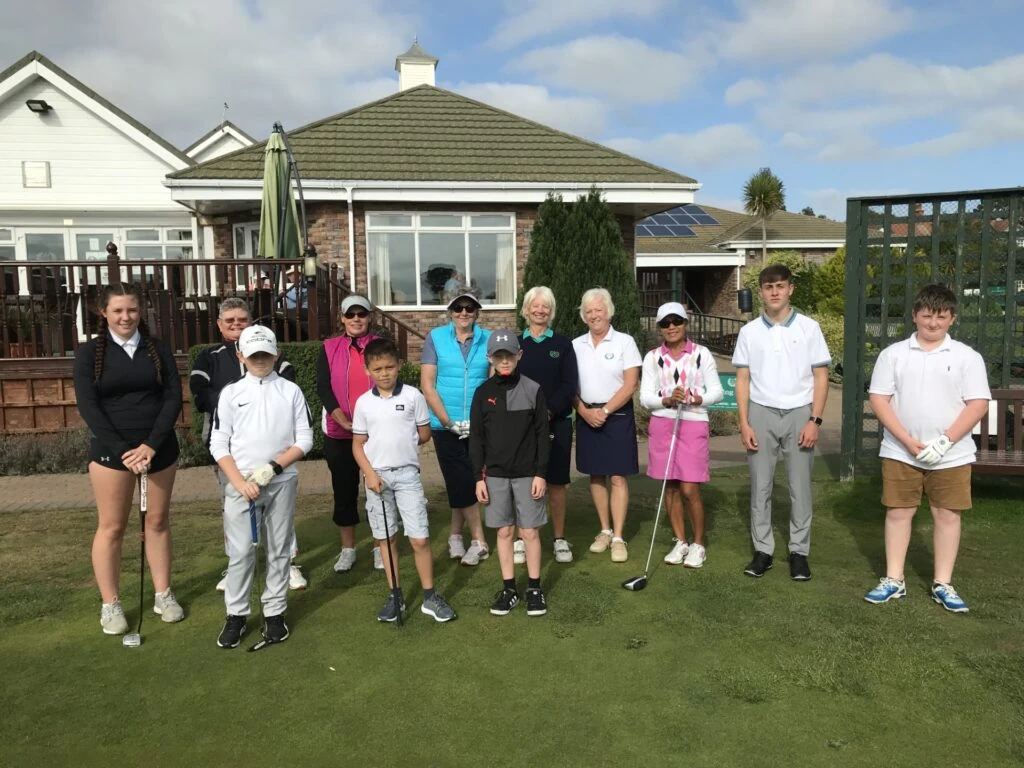 A group of people pose outside Seacroft Golf Club.