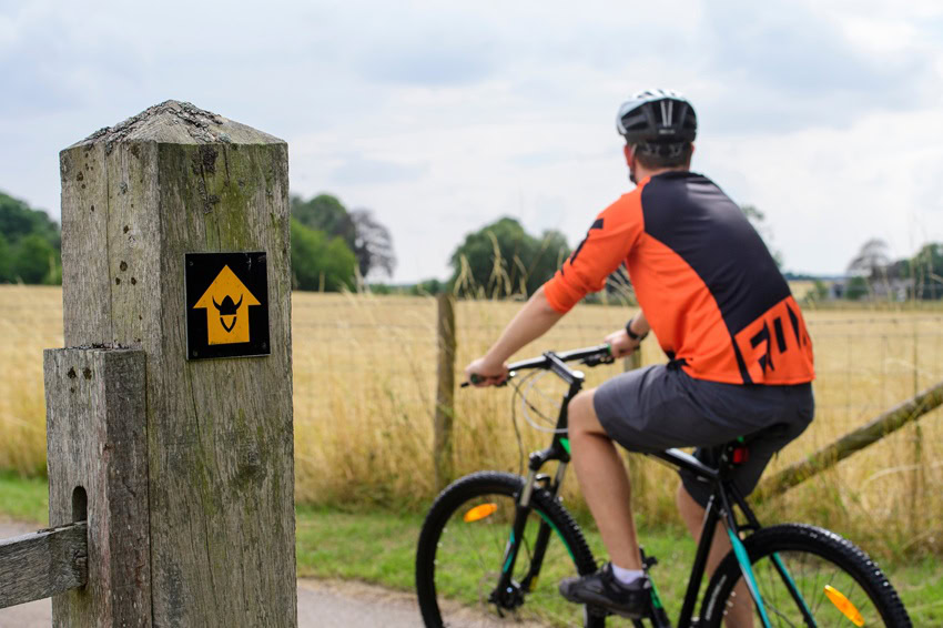 man cycling the Viking Way through fields
