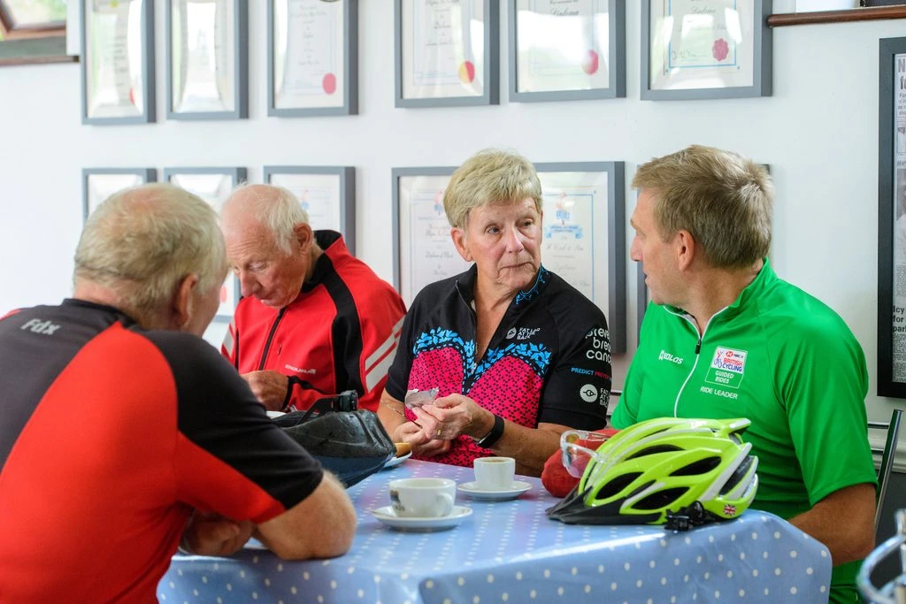 group of cyclers in a coffee shop